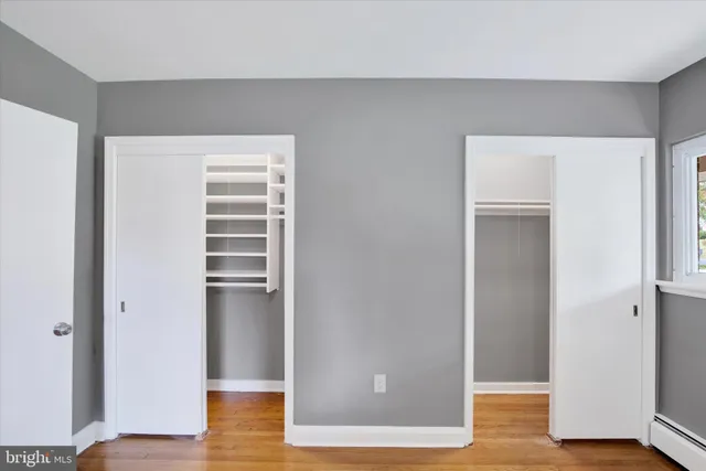 a bathroom with a sink a toilet a mirror a vanity and shower