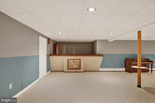 a bathroom with a sink a mirror and a light fixture