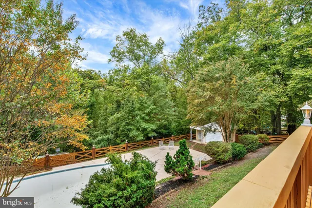 an aerial view of a house with a yard basket ball court and outdoor seating