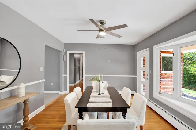 a view of a dining room with furniture window and wooden floor
