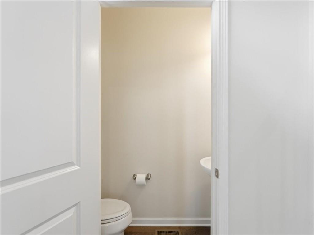 828 Oneida Circle Mars, PA 16046 - Photo 16 of 30 a bathroom with a granite countertop toilet and a shower