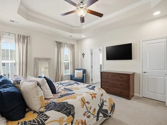 a bedroom with bed and window