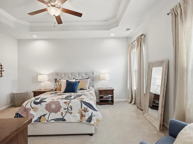 a bathroom with a double vanity sink a toilet and a mirror