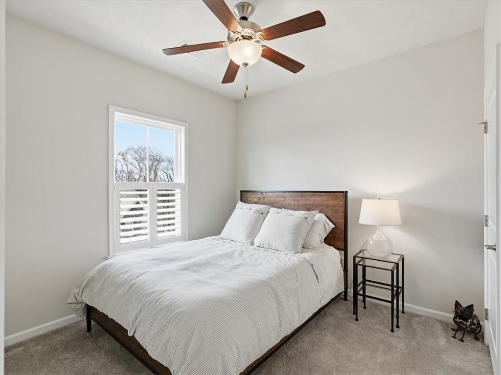 828 Oneida Circle Mars, PA 16046 - Photo 22 of 30 a bedroom with a bed and a chandelier