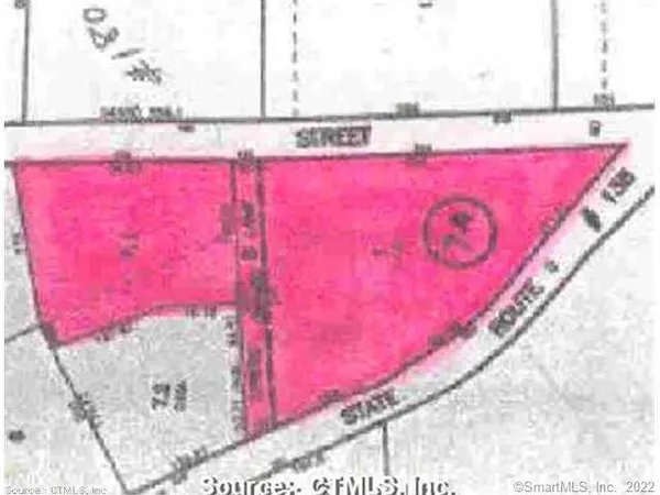 a bathroom with a bathtub and a mirror