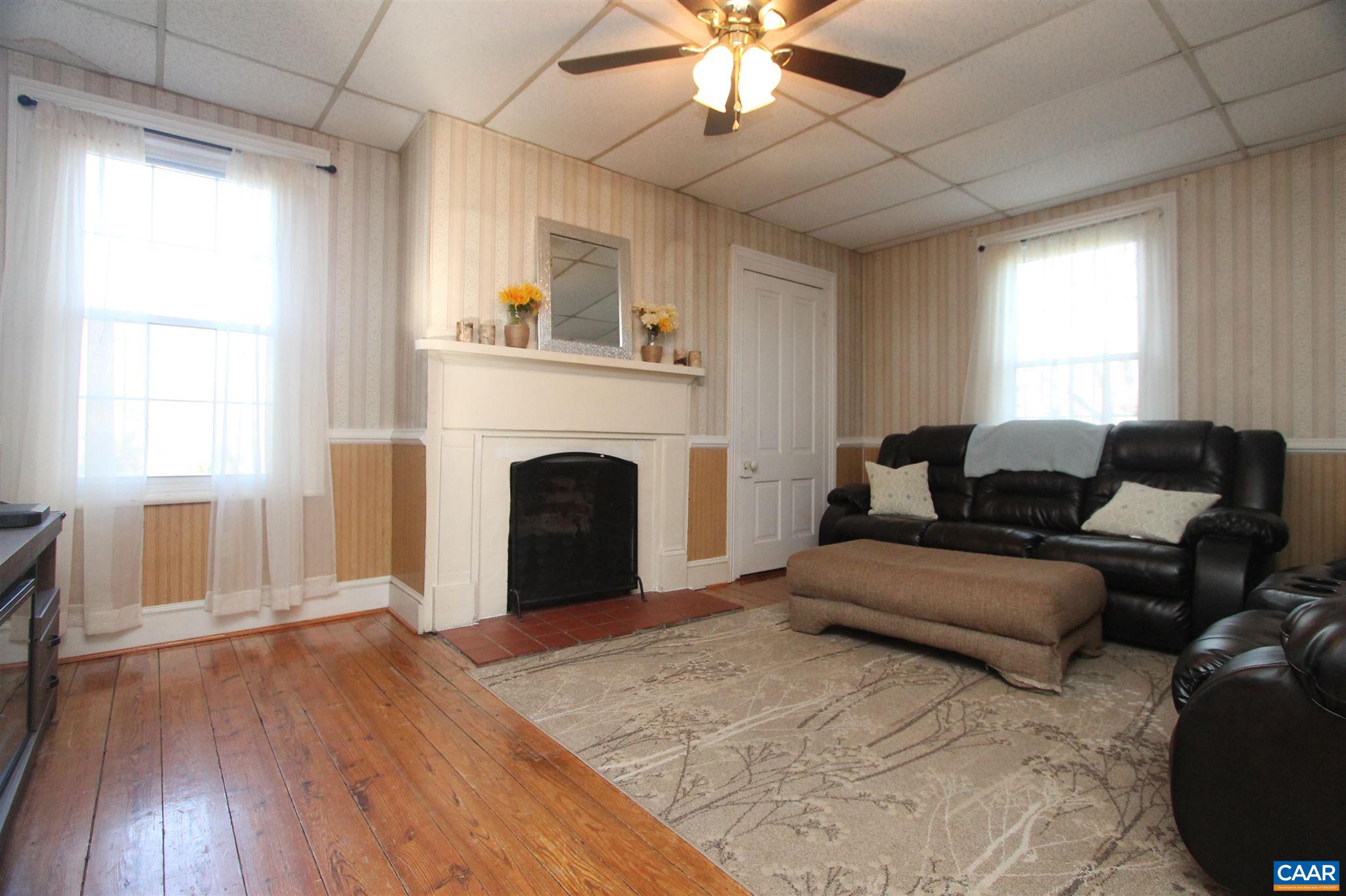 355 Gibbs Road Madison, VA 22727 - Photo 11 of 33 a living room with furniture and a fireplace