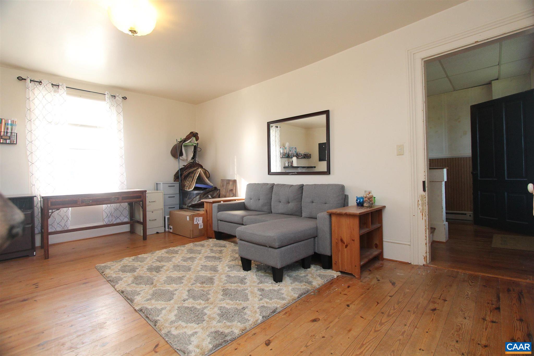 355 Gibbs Road Madison, VA 22727 - Photo 13 of 33 a living room with furniture and a piano