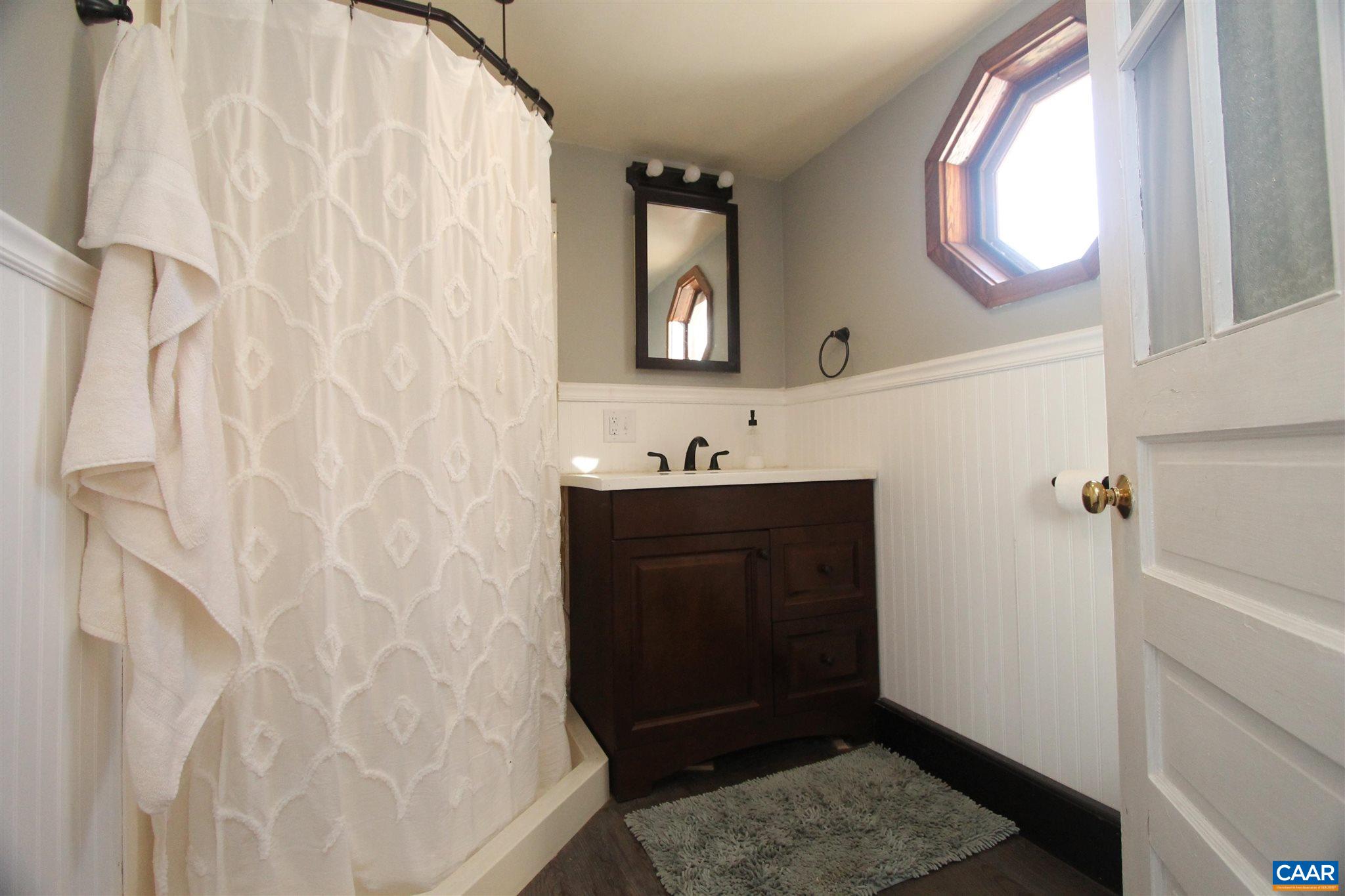 355 Gibbs Road Madison, VA 22727 - Photo 15 of 33 a bathroom with a sink and a mirror