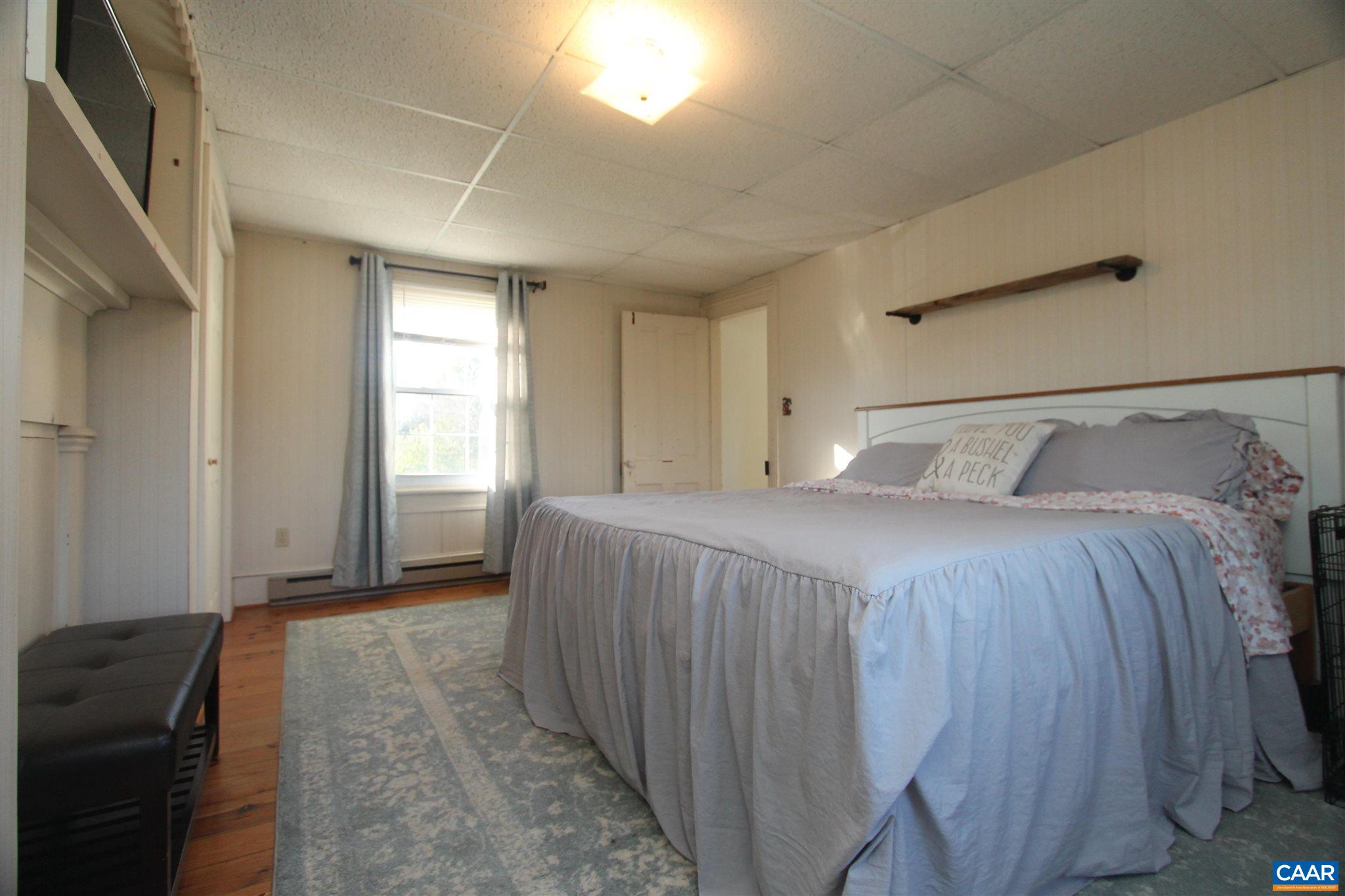 355 Gibbs Road Madison, VA 22727 - Photo 19 of 33 a bedroom with a bed and a window