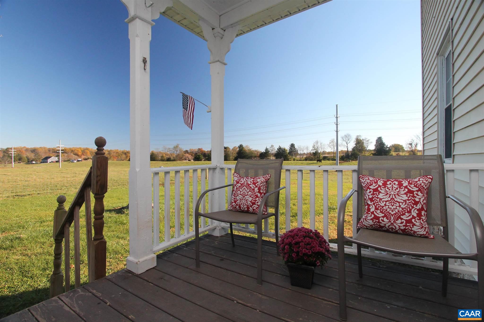 355 Gibbs Road Madison, VA 22727 - Photo 2 of 33 a balcony with chairs and wooden floor