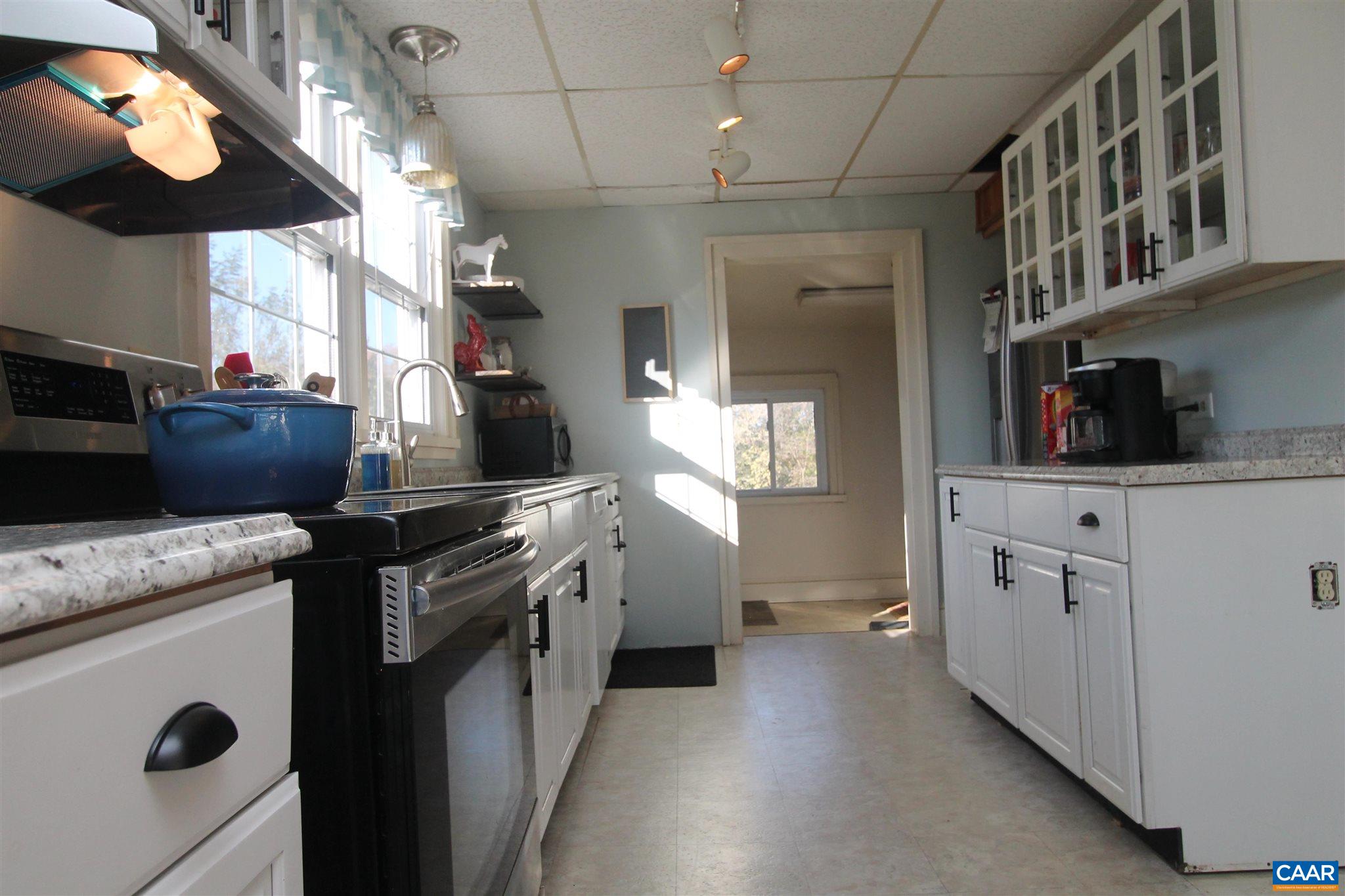 355 Gibbs Road Madison, VA 22727 - Photo 6 of 33 a kitchen with cabinets and window