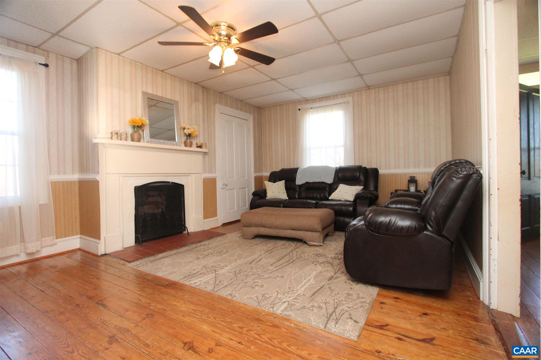 355 Gibbs Road Madison, VA 22727 - Photo 10 of 33 a living room with furniture and a fireplace