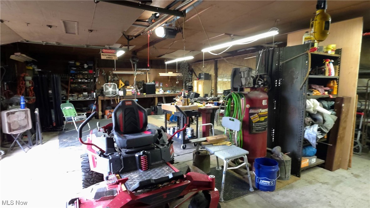 1440 Porter Road Atwater, OH 44201 - Photo 10 of 11 Garage with a workshop area and a garage door opener