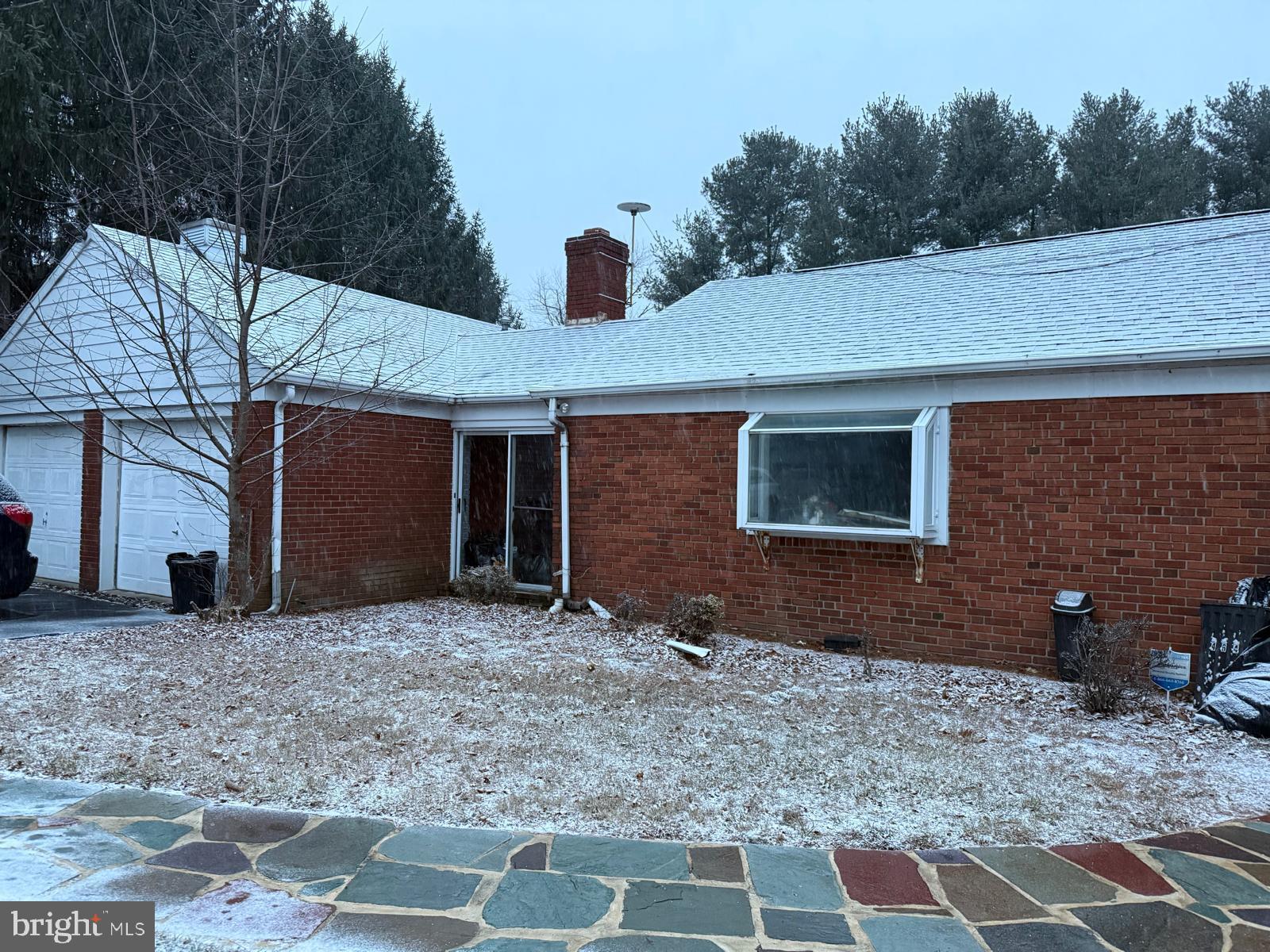 Charming brick home under a winter's touch.
