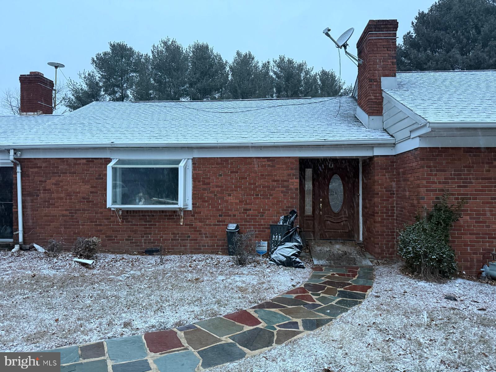 464 Conard Drive Springfield, PA 19064 - Photo 2 of 22 Charming brick home under a snowy sky.