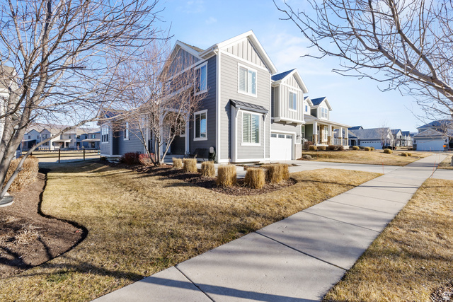 2745 Red Barn Road South Heber City, UT 84032 - Photo 4 of 51 View of home's exterior with board and batten siding, a residential view, driveway, and a garage