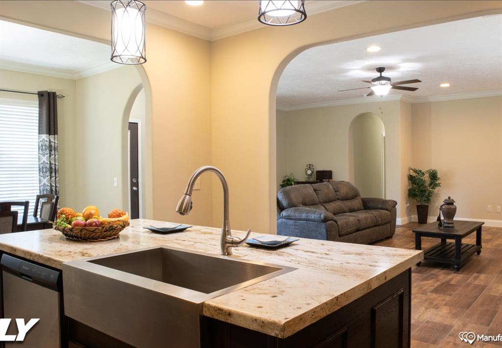 3 Vickie Court Chico, TX 76431 - Photo 5 of 17 a kitchen with a sink a counter and chairs