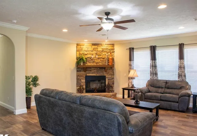 a living room with furniture and a fireplace