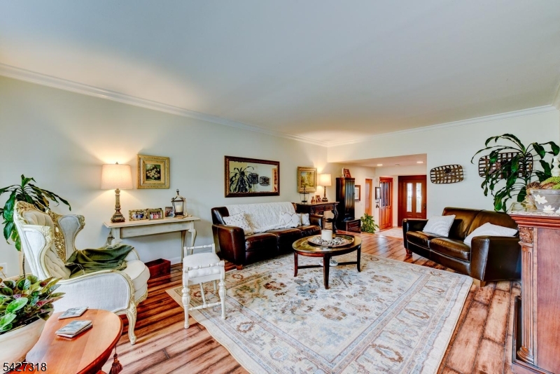 52 Ashburn Road Wayne, NJ 07470 - Photo 12 of 49 a living room with furniture and a rug