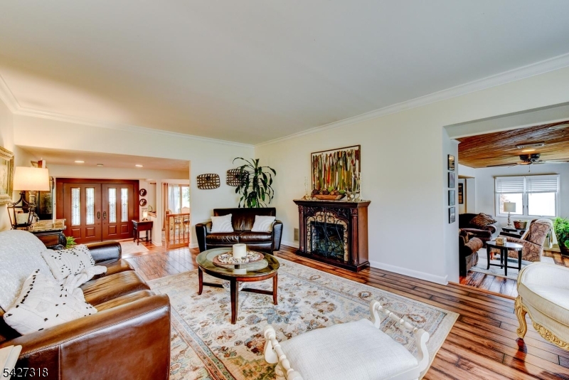 52 Ashburn Road Wayne, NJ 07470 - Photo 13 of 49 a living room with furniture and a fireplace