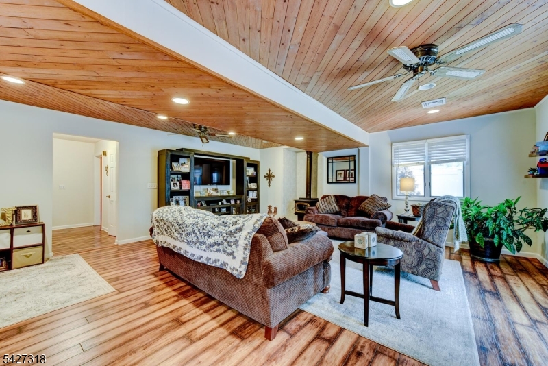 52 Ashburn Road Wayne, NJ 07470 - Photo 14 of 49 a living room with furniture and a ceiling fan