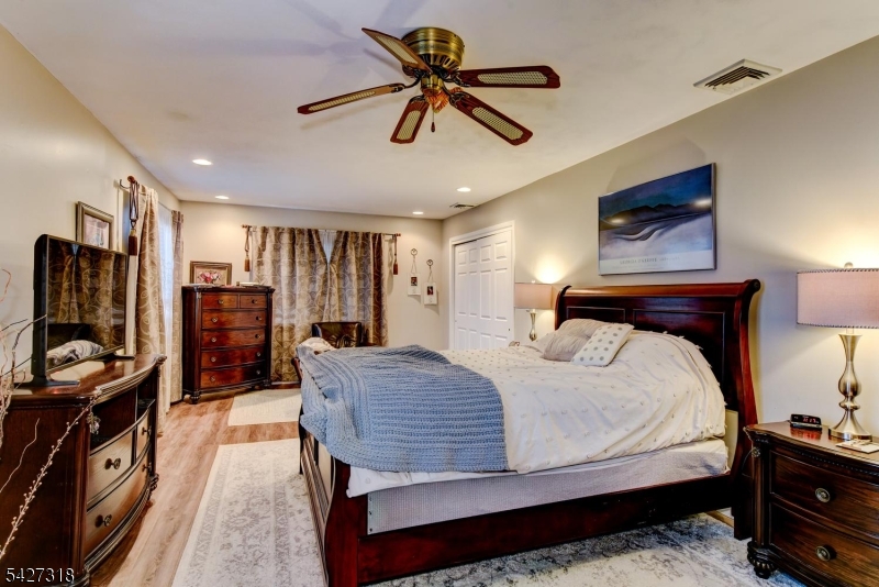 52 Ashburn Road Wayne, NJ 07470 - Photo 26 of 49 a bedroom with a bed and a walk in closet
