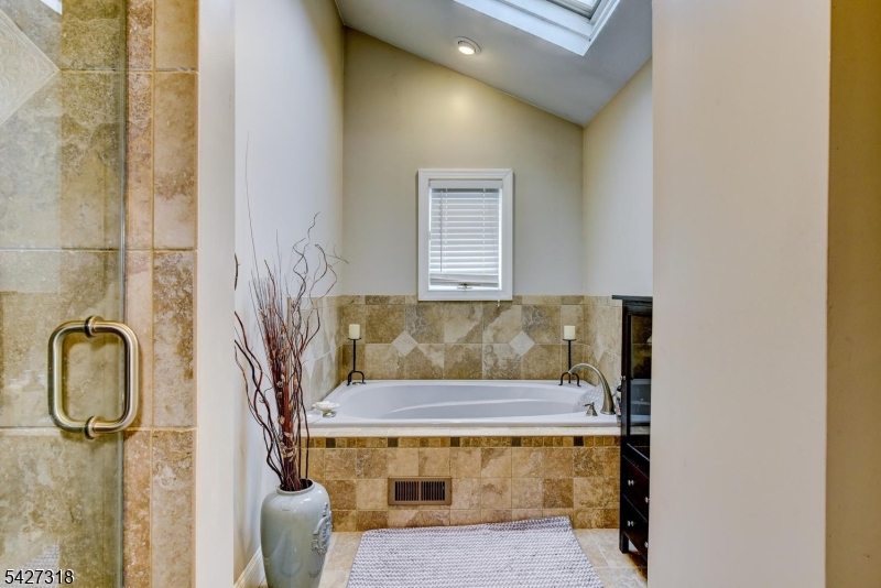 52 Ashburn Road Wayne, NJ 07470 - Photo 28 of 49 a bathroom with a sink toilet and shower