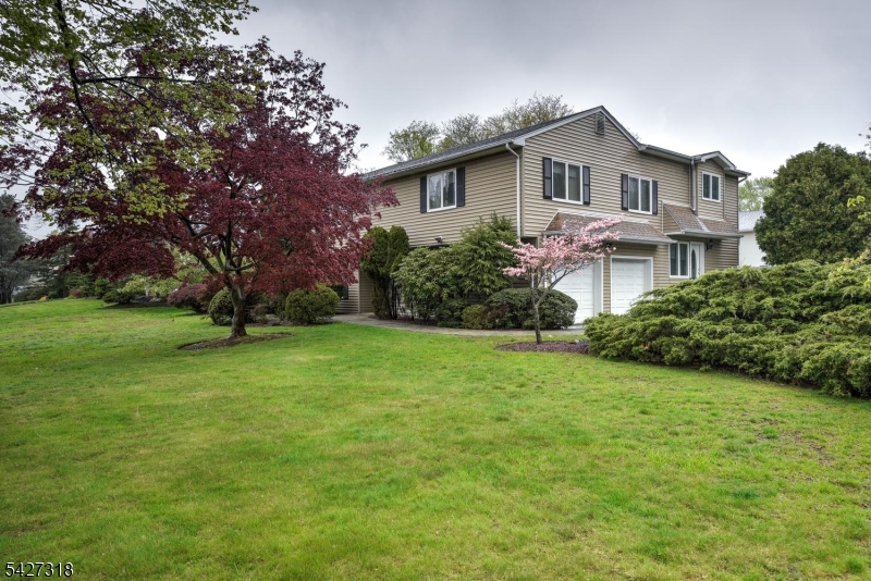 52 Ashburn Road Wayne, NJ 07470 - Photo 4 of 49 a front view of a house with garden