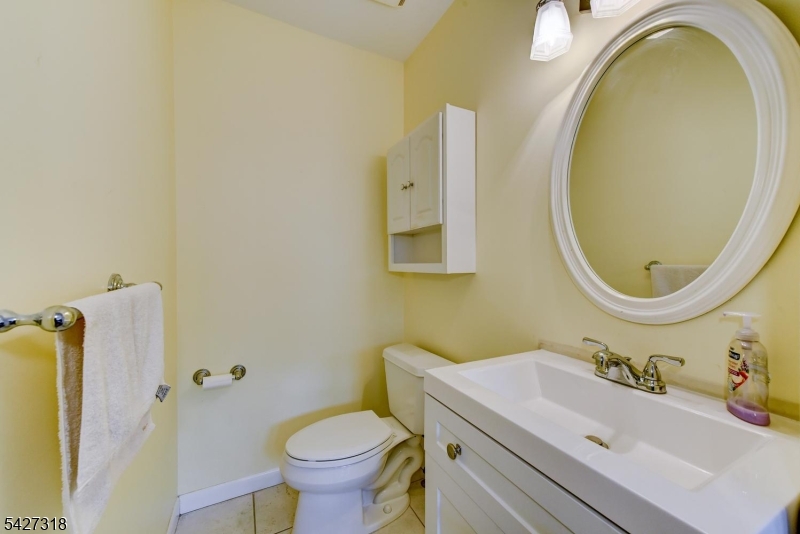 52 Ashburn Road Wayne, NJ 07470 - Photo 43 of 49 a bathroom with a sink and a mirror