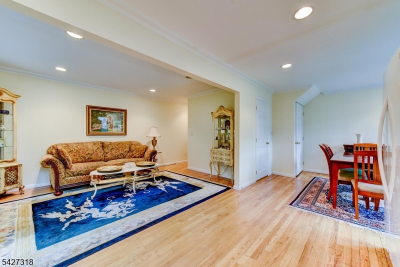 52 Ashburn Road Wayne, NJ 07470 - Photo 44 of 49 a living room with furniture and a wooden floor