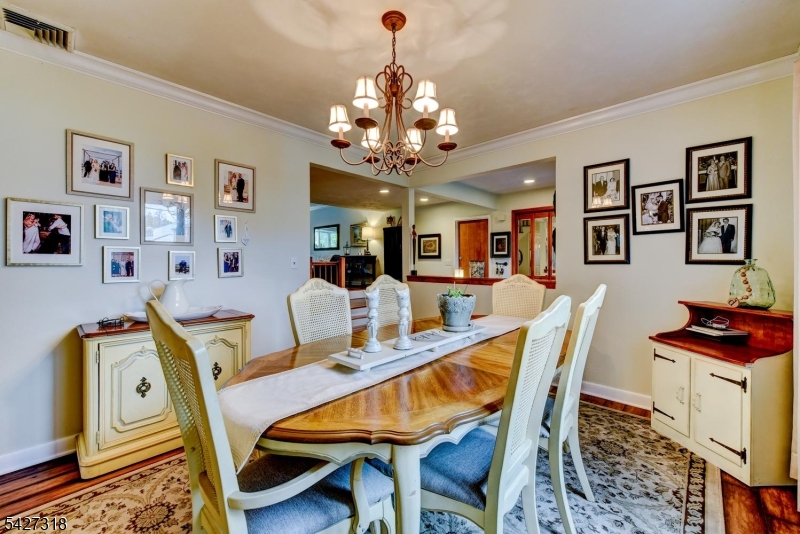52 Ashburn Road Wayne, NJ 07470 - Photo 9 of 49 a dining room with furniture and window