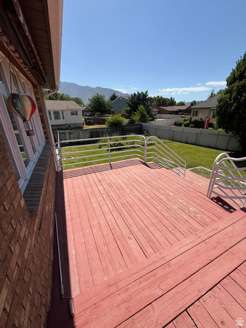 328 Heather Ridge Circle Sandy, UT 84070 - Photo 14 of 32 Spacious wood deck with white metal railings and brick exterior