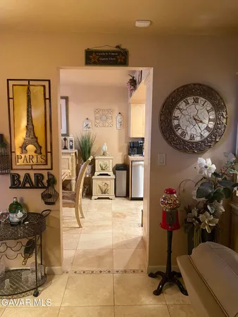 a view of a livingroom with furniture and a flat screen tv