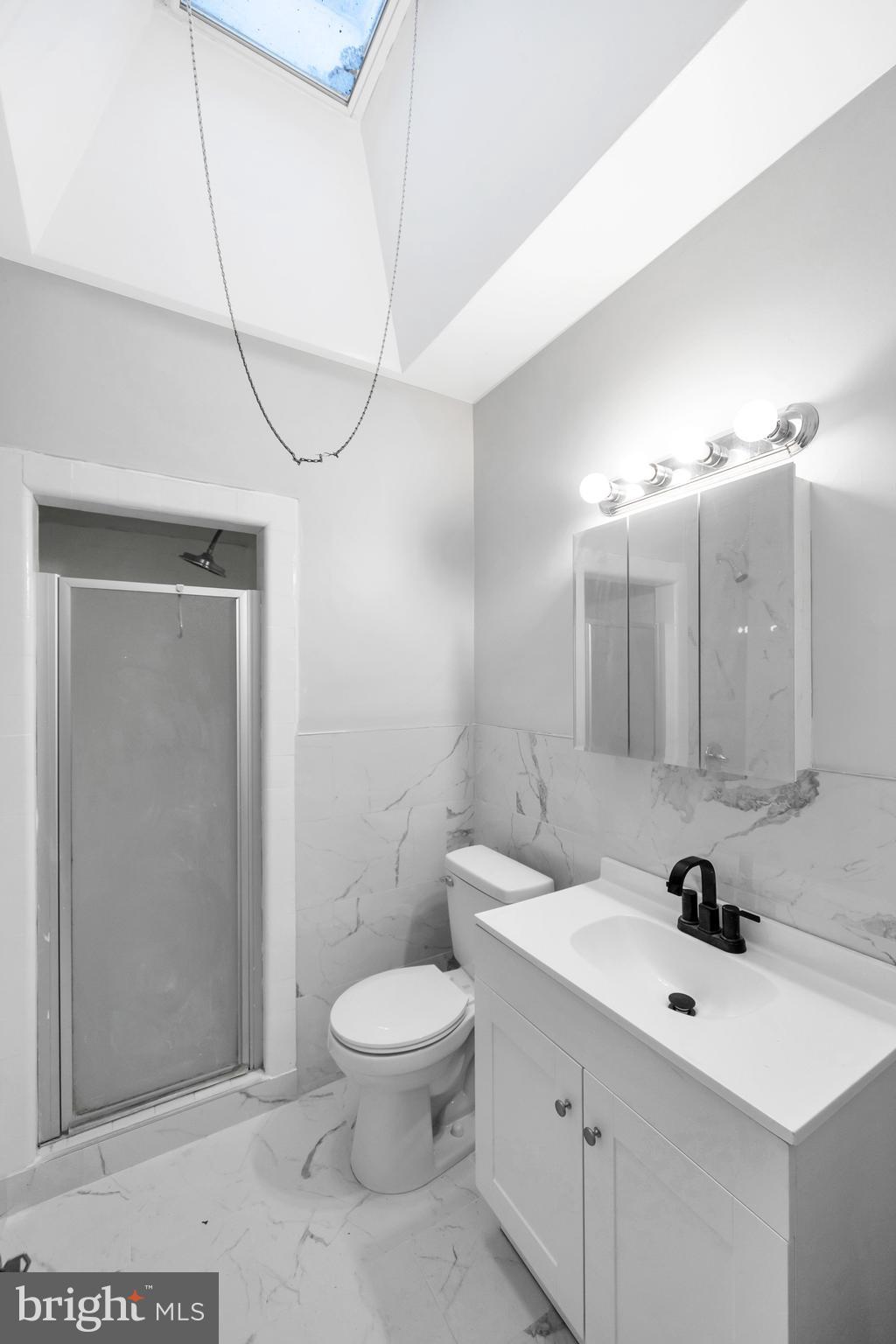 244 Wembly Road Upper Darby, PA 19082 - Photo 11 of 26 a bathroom with a toilet sink and mirror