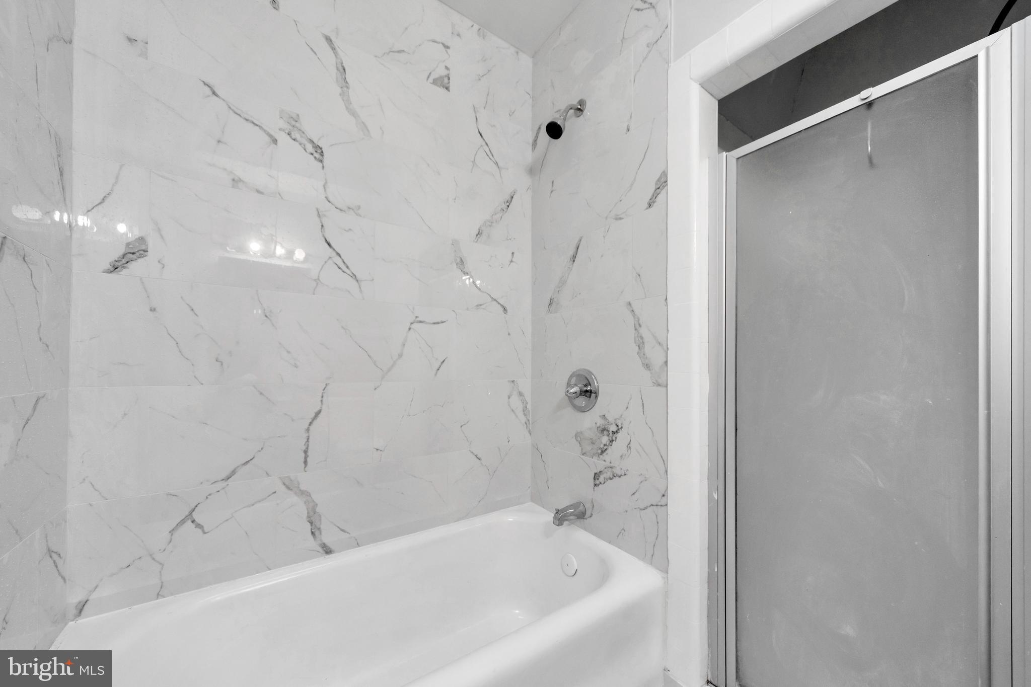 244 Wembly Road Upper Darby, PA 19082 - Photo 13 of 26 a bathroom with a bathtub