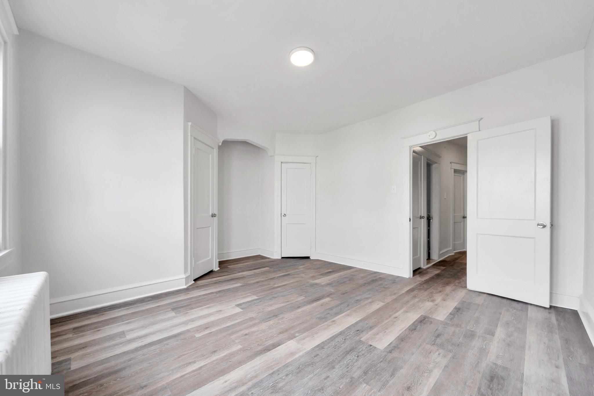 244 Wembly Road Upper Darby, PA 19082 - Photo 14 of 26 a view of an empty room and wooden floor