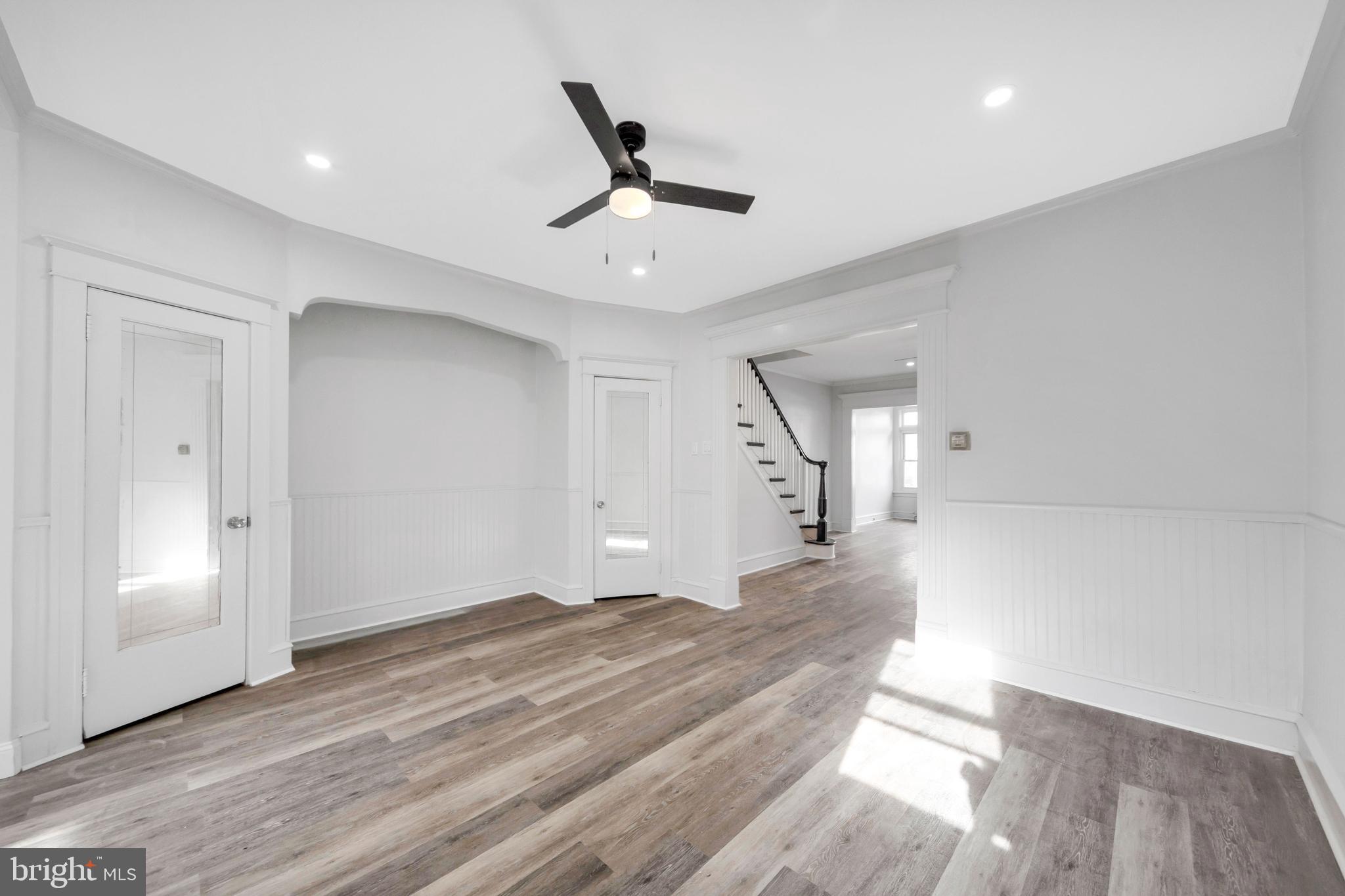 244 Wembly Road Upper Darby, PA 19082 - Photo 20 of 26 a view of a livingroom with a ceiling fan and wooden floor