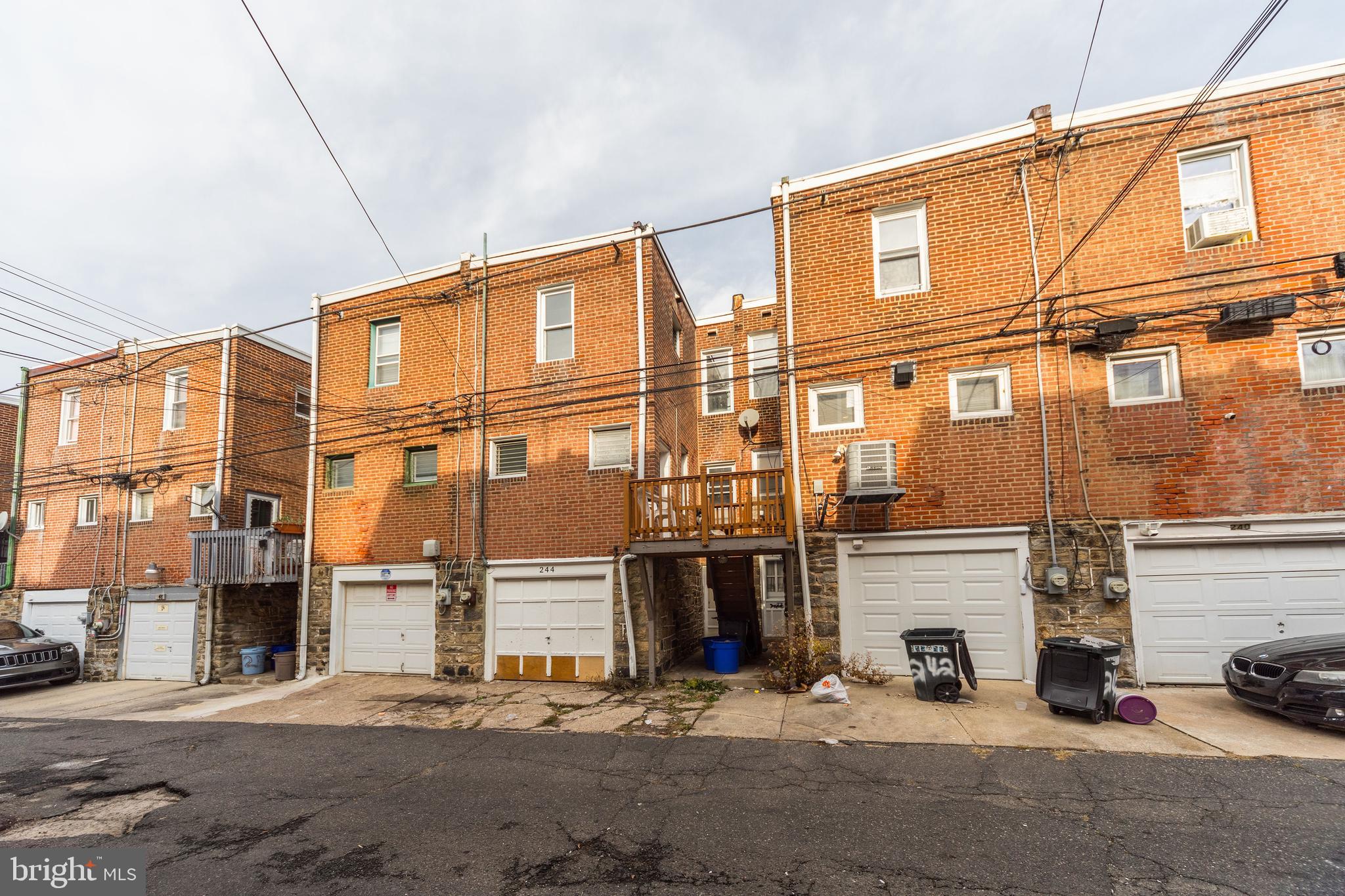 244 Wembly Road Upper Darby, PA 19082 - Photo 23 of 26 a front view of a building with parking space