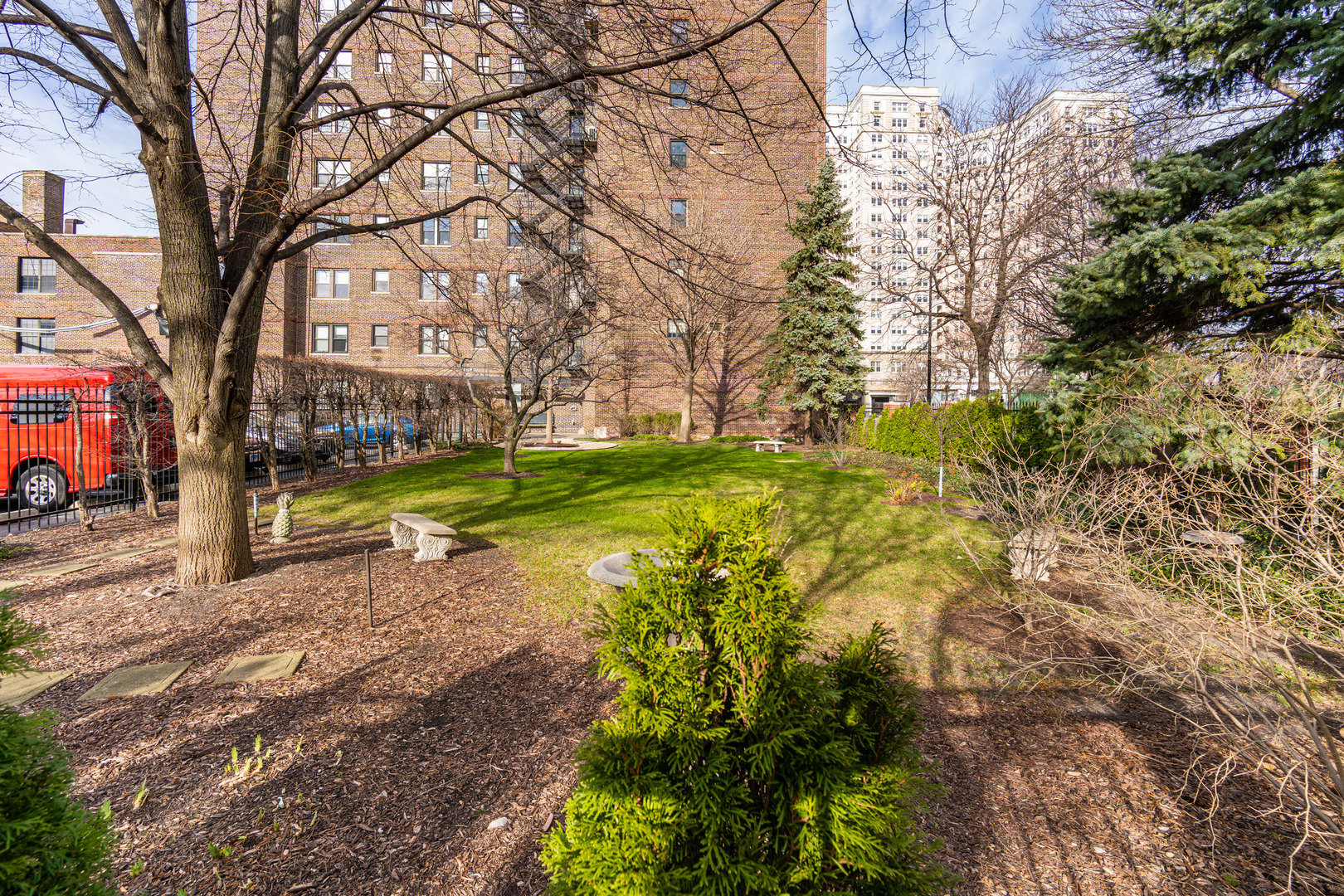 5510 North Sheridan Road, Unit 10A Chicago, IL 60640 - Photo 39 of 40 a view of yard with swimming pool and green space