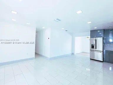 14331 Southwest 286th Street Homestead, FL 33033 - Photo 11 of 18 a view of kitchen with refrigerator and microwave