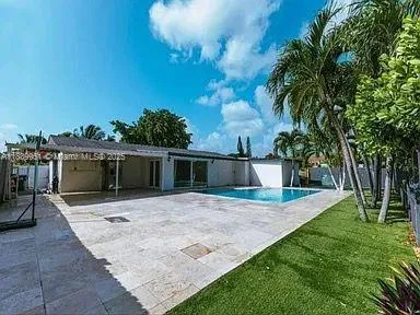 a view of a backyard of the house