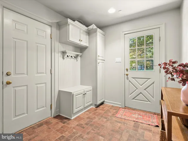 a view of a dining room with furniture and window
