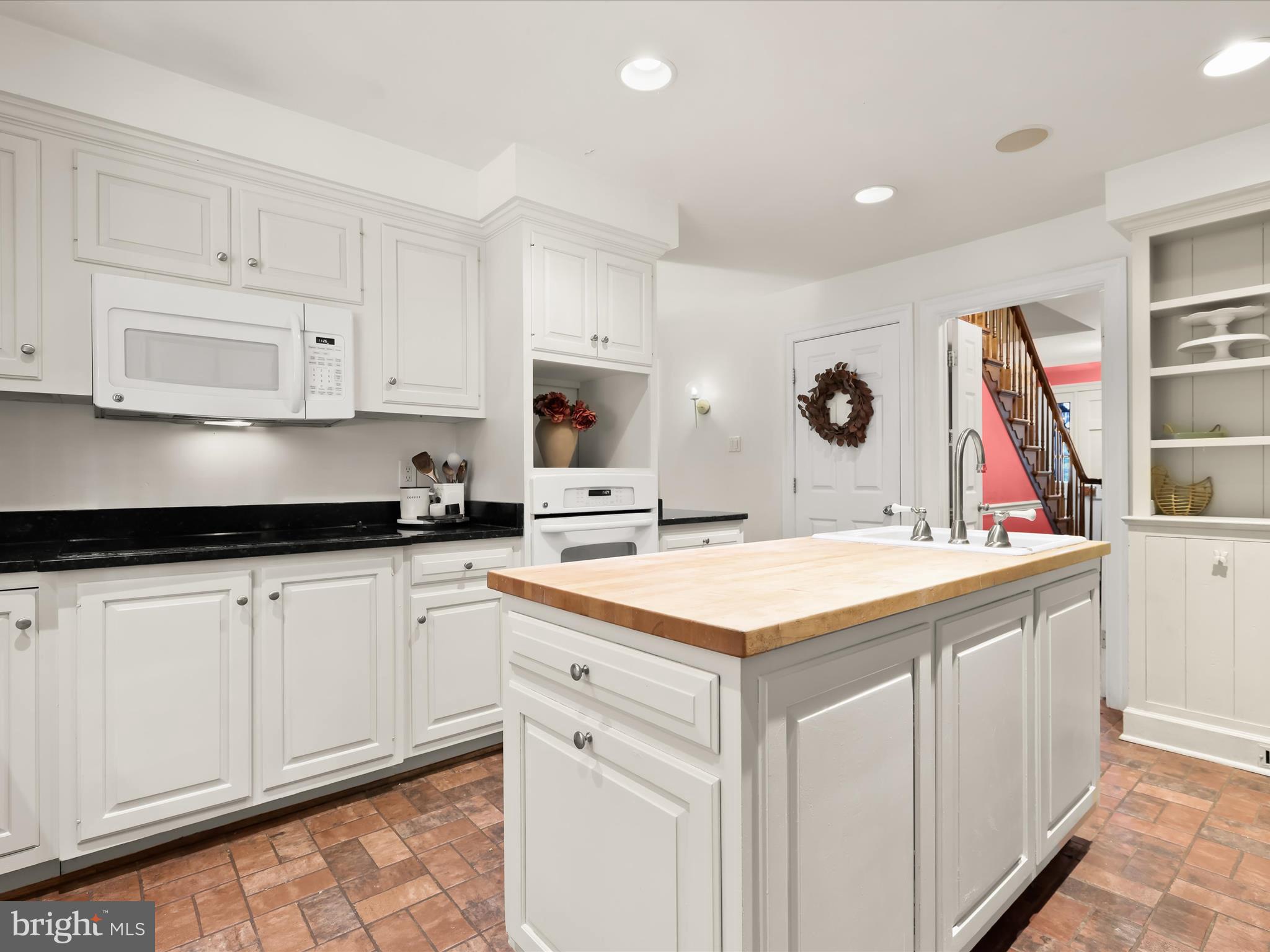 5708 Emory Road Upperco, MD 21155 - Photo 18 of 78 a kitchen with stainless steel appliances granite countertop a sink and cabinets