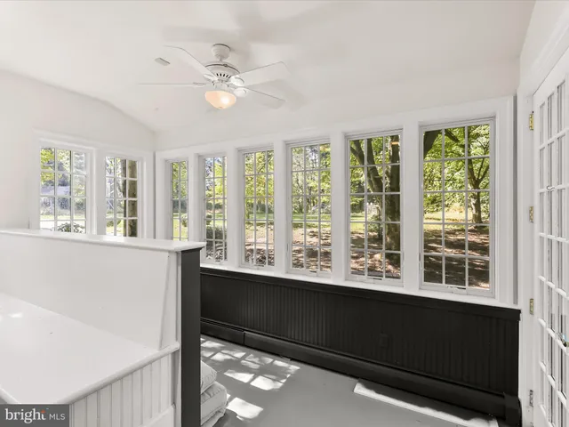 a view of an entryway with wooden floor