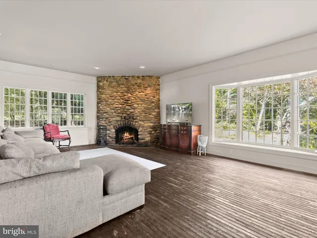 a white bath tub sitting next to a white toilet