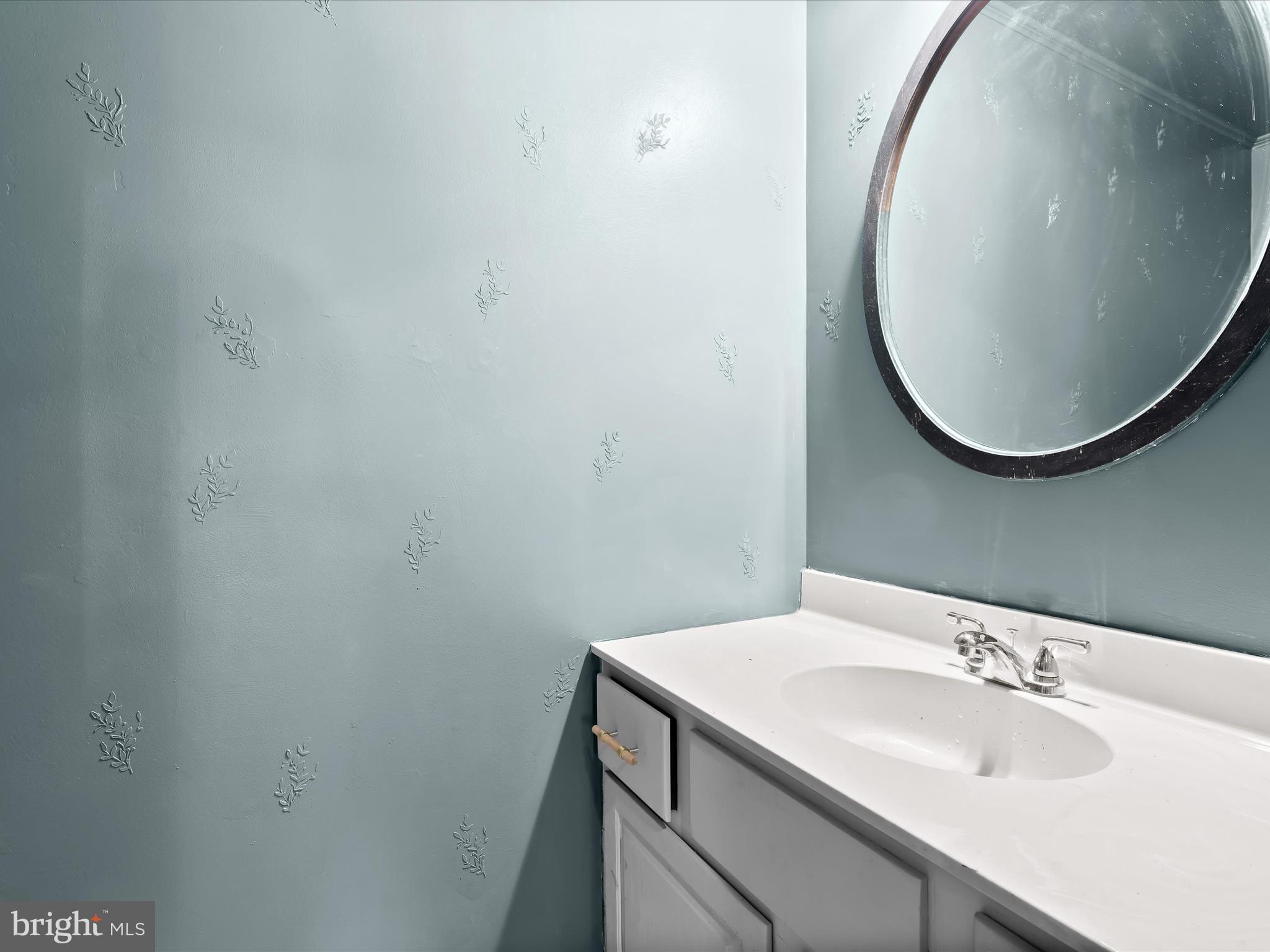 5708 Emory Road Upperco, MD 21155 - Photo 36 of 78 a bathroom with a sink and a mirror