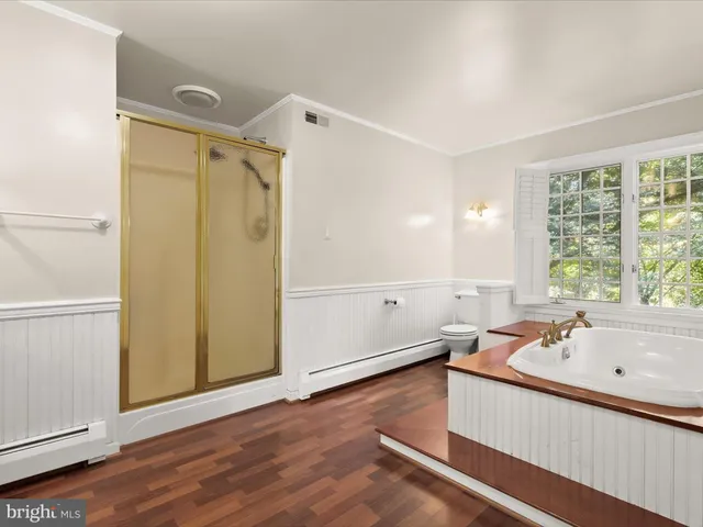 a house view with a sitting space and garden