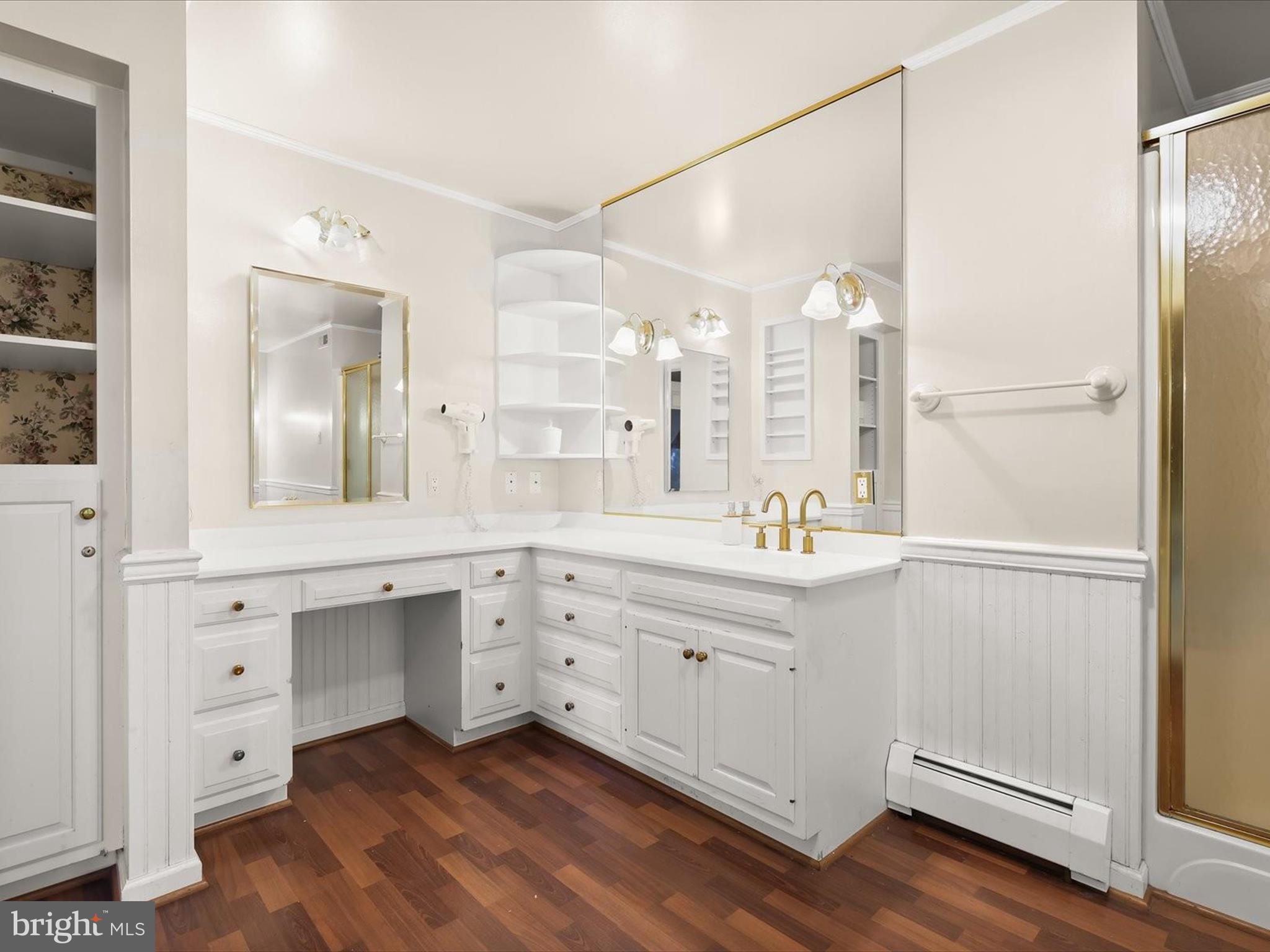 5708 Emory Road Upperco, MD 21155 - Photo 46 of 78 a spacious bathroom with a double vanity sink a mirror and a shower