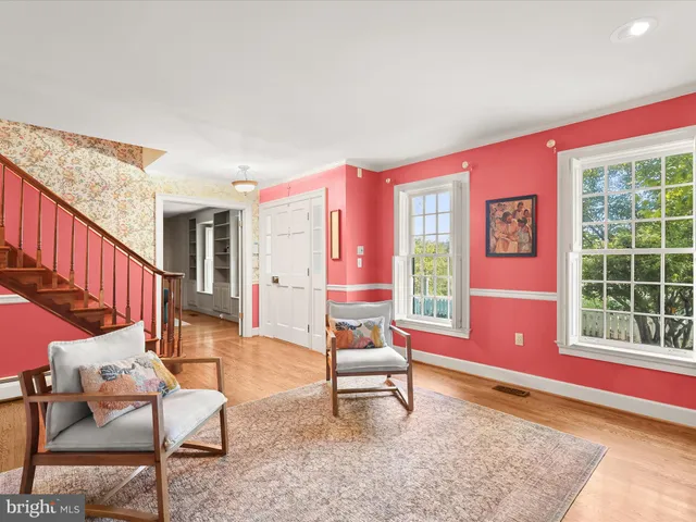 a living room with furniture and a rug