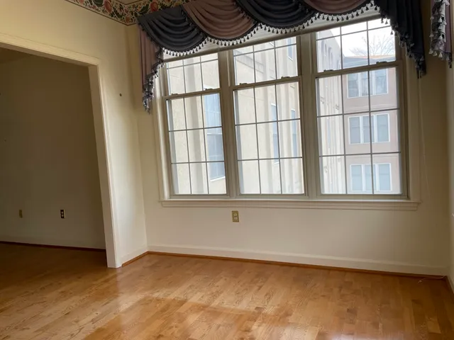 a view of room with wooden floor